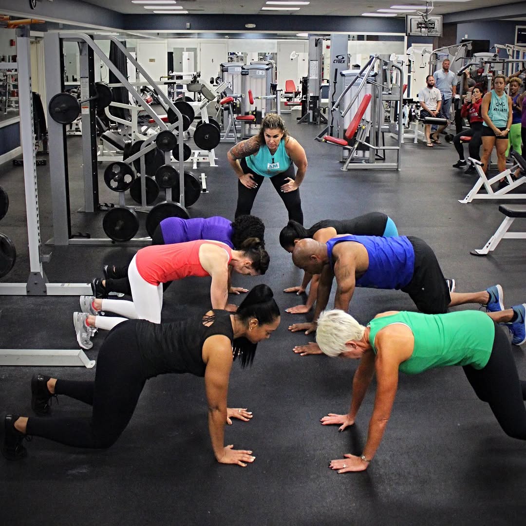 DMP Fitness clients training together during a small group plank session
